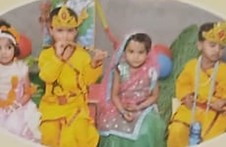Small children dressed as Krishna and Radha for Janmashtami.